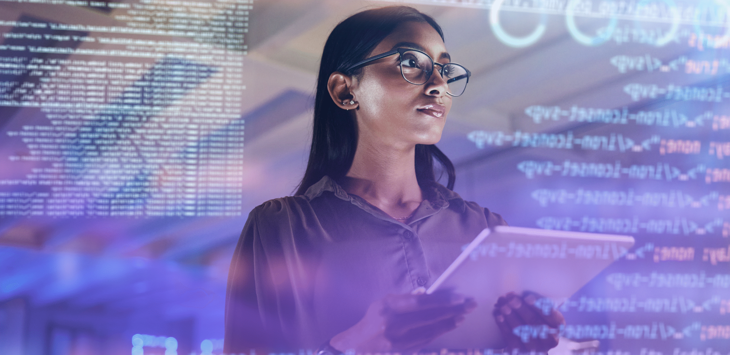 A woman wearing glasses holds a tablet while analyzing code displayed on a transparent digital screen overlay. The background has a futuristic, tech-driven ambiance with glowing text and data projections.